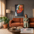 Rosto de mulher de perfil com olhos fechados e pó colorido laranja e verde se dispersando, quadro decorativo