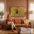 Pássaro vermelho com pintas brancas pousado em capim dourado sobre fundo verde desfocado, quadro decorativo