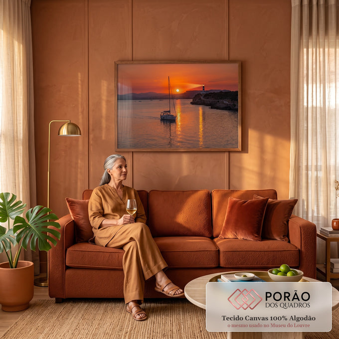 Quadro Decorativo Grande Veleiro e Farol Laranja para Sala | quadros decorativos para sala de estar | veleiro navegando ao pôr do sol com farol aceso sobre penhasco rochoso | em ambiente 3 | Porao dos Quadros
