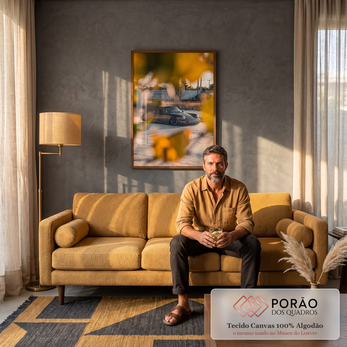 Quadro Decorativo Grande Carro Preto para Sala Cinza | quadros decorativos para sala de estar | carro esportivo cinza escuro visto através de folhas amarelas ao pôr do sol | em ambiente 3 | Porao dos Quadros
