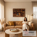 Quadro Decorativo Grande Mulher Lendo Marrom para Escritório | quadros decorativos para sala de estar | mulher deitada lendo livro no chão entre estantes repletas de livros coloridos | em ambiente 3 | Porao dos Quadros